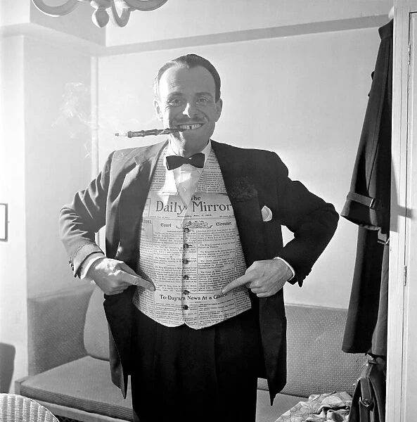 Terry Thomas tries out the waistcoat designed using the Daily Mirror at the Palladium