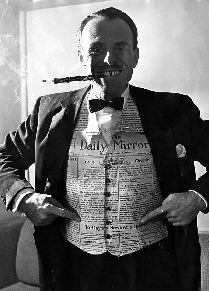 Terry Thomas wearing a waiscoat made from a Daily Mirror. 6th November 1953