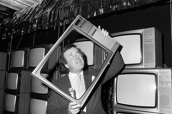 Terry Wogan was given 100 new TV sets today. They are being presented by Phillips the TV