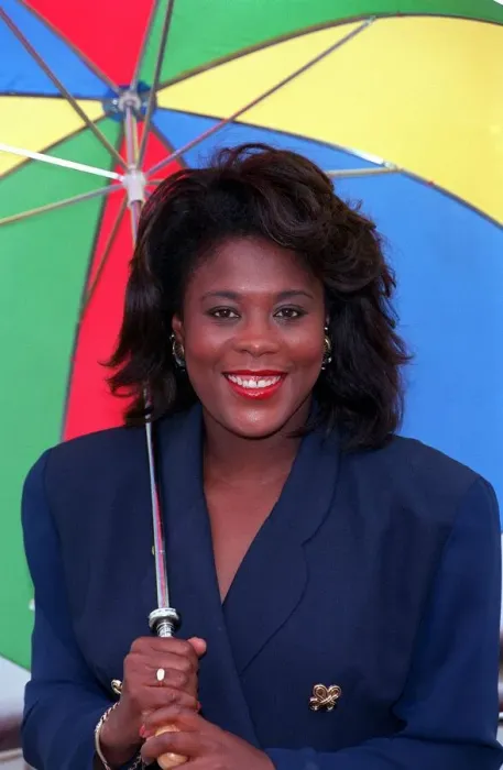 Framed Print : TESSA SANDERSON, ATHLETE - HOLDING MULTI-COLOURED UMBRELLA 15  /  07  /  1992
