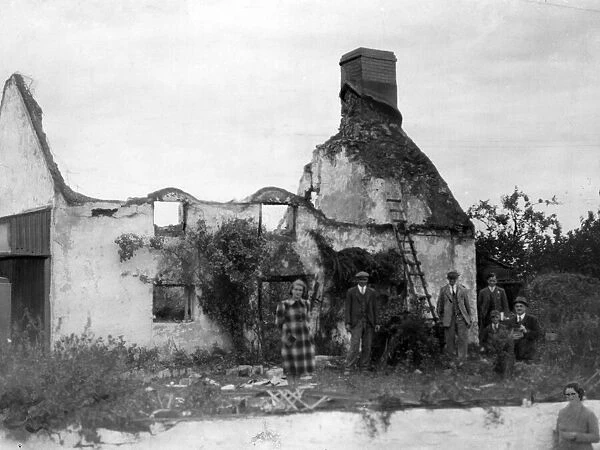 Thatched cottage in South Wales destroyed by an incendiary bomb. Circa 1941