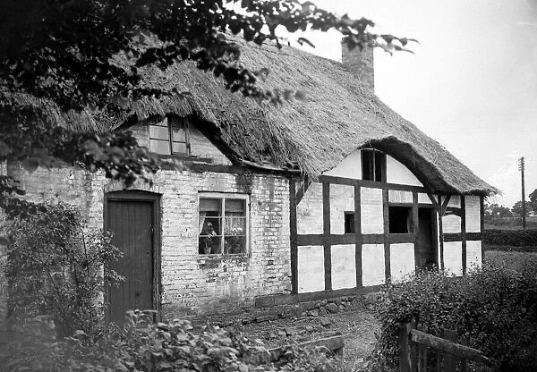 Thatched roof cottage of Izaak Walton in the village of Shallowford July 1923 Alf