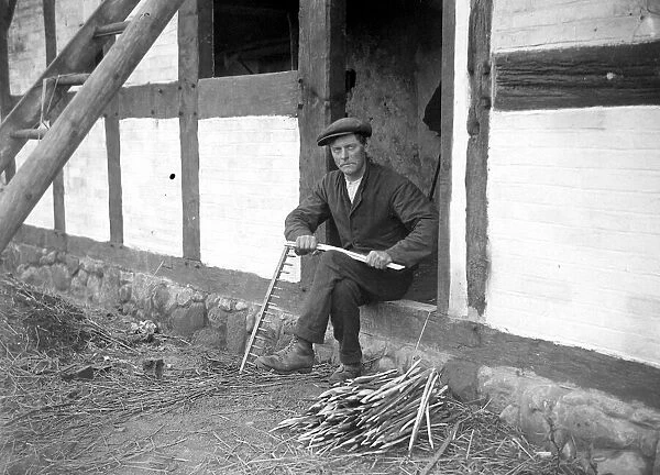 Thatcher at work at writer Izaak Waltons cottage in the village of Shallowford July