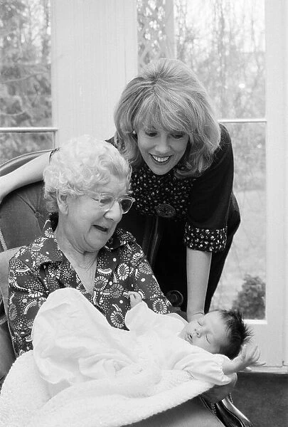 'Thats Life'presenter Esther Rantzen presents her month old baby Emily to