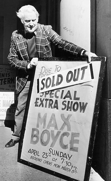 Theatre worker Ted Grant places the sign outside the Coventry Theatre telling the bad