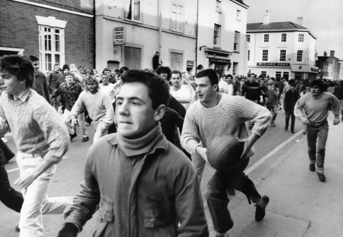 Framed Print : Thousands of villagers line the streets of Atherstone for the traditional Shrove Tuesday Framed Print : Thousands of villagers line the streets of Atherstone for the traditional Shrove Tuesday