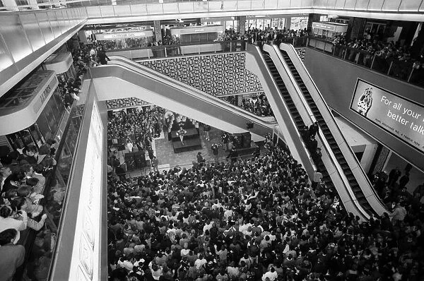 Thousands of young pop fans gather at the Bull Ring Shopping Centre for pop singer