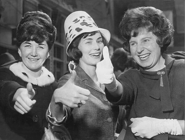 Thumbs up from three Manchester United wives l-r, Mrs Anne Dunne