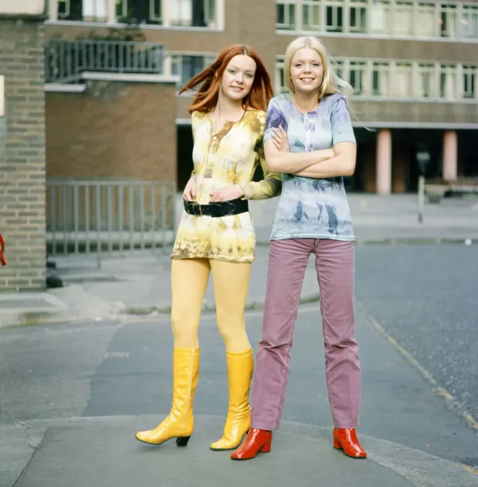 Framed Print : Tie-dye shirts worn by models, Jane (red hair) and Linda (blond hair). 3rd March 1970