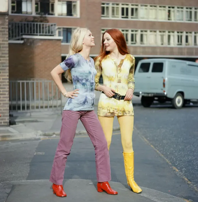 Framed Print : Tie-dye shirts worn by models, Jane (red hair) and Linda (blond hair). 3rd March 1970
