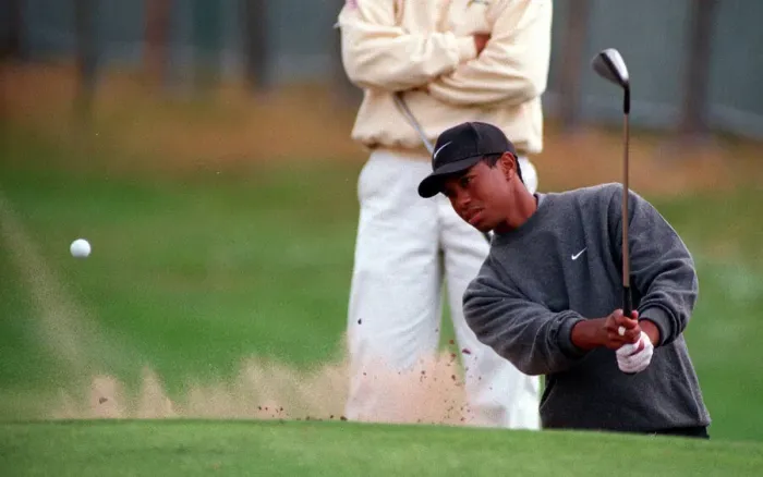 Framed Print : Tiger Woods practises for Open Golf Championship July 1997 playing his way out of a