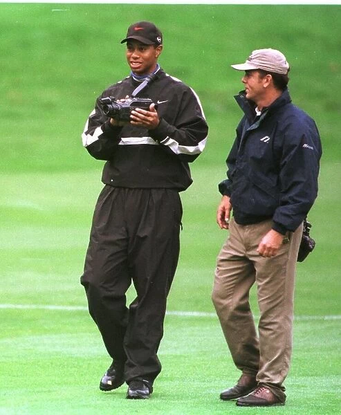 Tiger Woods watches his swing on video October 1998 during his practice round in