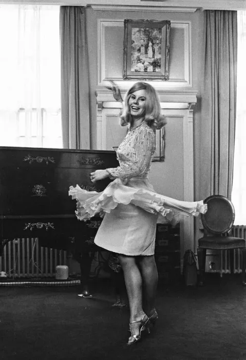 Framed Print : Tina Moore 23, wife of England Captain Bobby Moore, trying on the new dress she will wear Framed Print : Tina Moore 23, wife of England Captain Bobby Moore, trying on the new dress she will wear