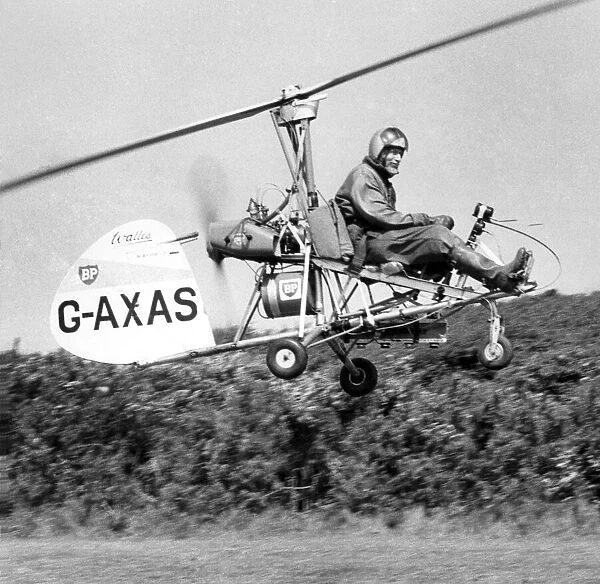 A tiny Autogyro, flown by its designer Wing Cmdr. Ken Wallis searched the areas of