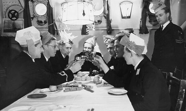 A toast to the King during a Christmas party in the ward room of HMS Westminster