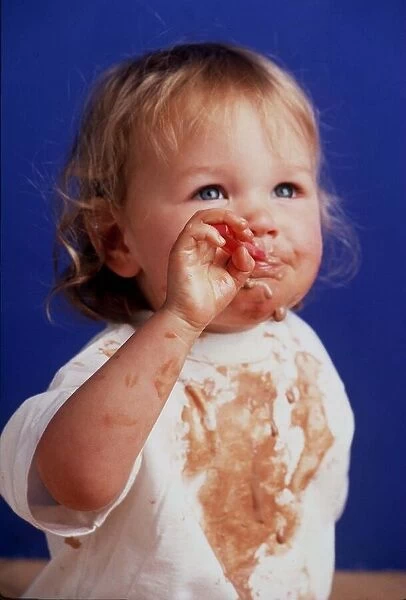 A toddler is pictured eating in April 1999