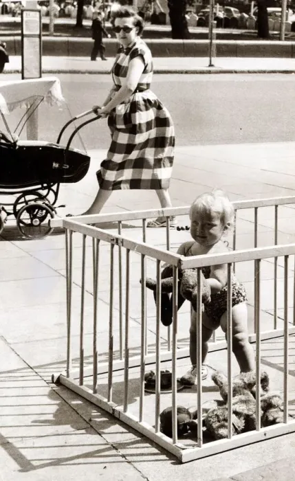Framed Print : Toddler in a play pen, placed on a pavement. Circa 1960 Framed Print : Toddler in a play pen, placed on a pavement. Circa 1960