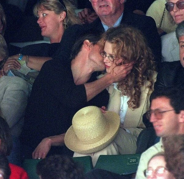 Tom Cruise kissing wife actress Nicole Kidman at Wimbledon tennis championships