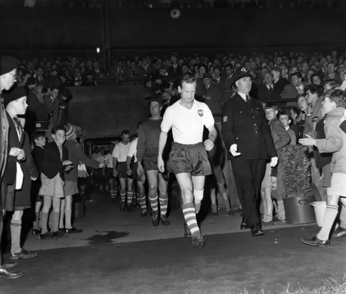 Framed Print : Tom Finneys Testimonial Match. Tom leads his team on to the fiels
