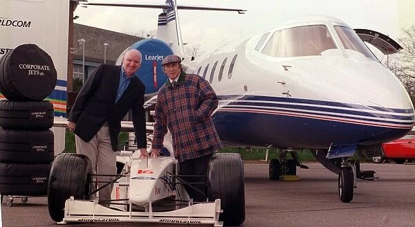 Tom Hunter with Jackie Stewart March 1999 with a race car with the new Lear Jet