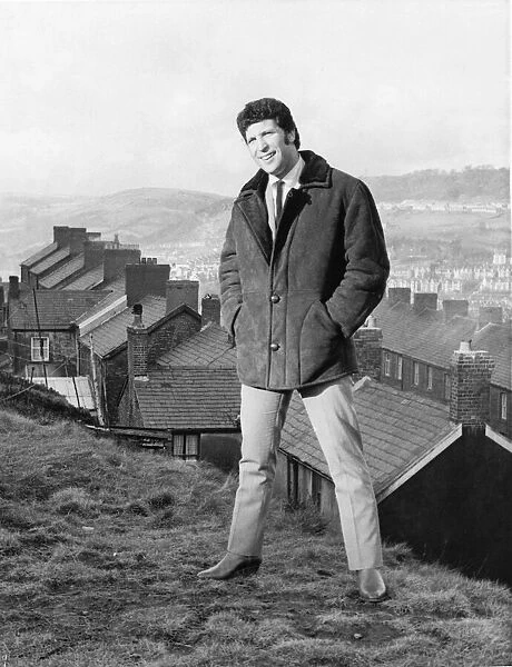 Tom Jones, a boy on top of the world, on the mountain top above his hometown of