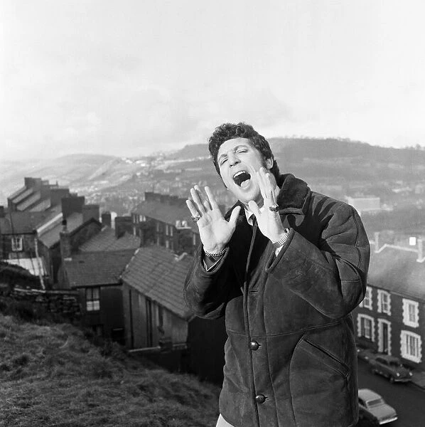 Tom Jones, a boy on top of the world, sings from the mountain top above his hometown of