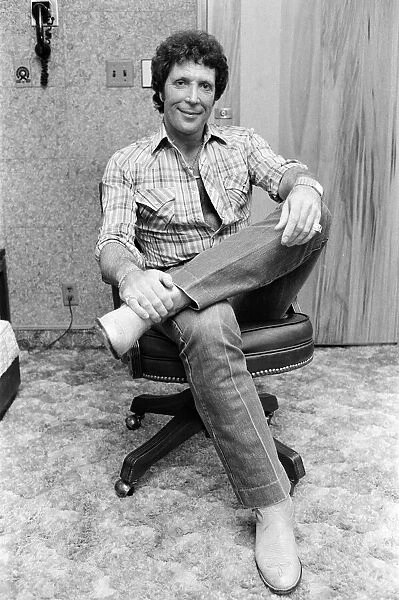 Tom Jones in concert in America. Pictured relaxing backstage. April 1983