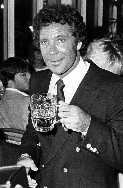 Tom Jones enjoys a pint at the Celtic Manor Hotel, Newport. 11th September 1983