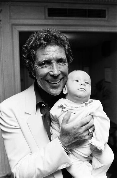 Tom Jones with his grandson Alexander, aged eleven months, in their London hotel