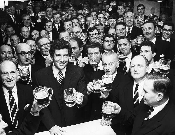 Tom Jones Singer having a drink with members of the wales male voice choir