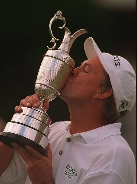 Tom Lehman kisses Claret jug trophy after winning British Open golf championship at