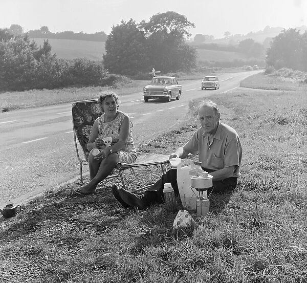 Tom and Lily Mattingly of Brentwood, Essex enjoy a picnic on the side of the main Newton