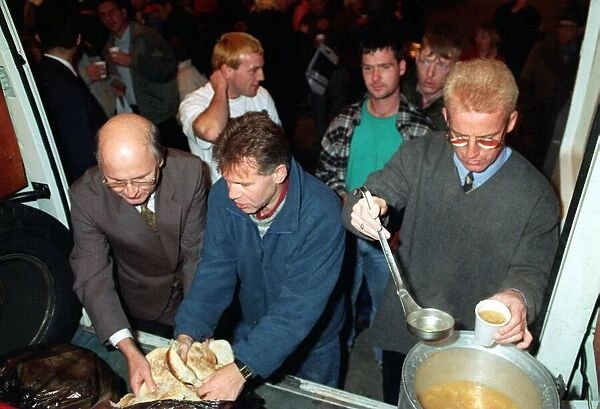 TOMMY BURNS CELTIC MANAGER AND FERGUS McCANN WHO ASSISTED THE CHARITY WORKERS IN FEEDING