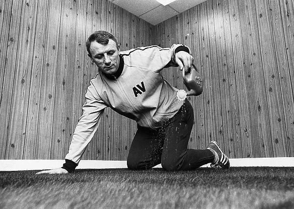 Tommy Docherty football manager Aston Villa FC watering carpet in his office watering can
