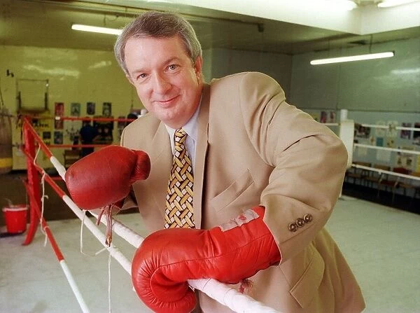 Tommy Gilmour boxing promoter 1999 boxer promoter wearing boxing gloves
