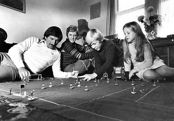Tommy Smith plays table soccer with his wife Sue, and children Darren (11) and Janette (8
