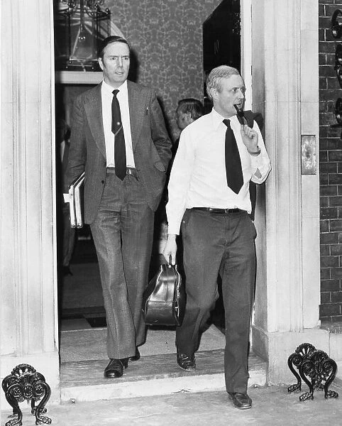 Tony Benn and colleague walking from 10 Downing Street, Westminster