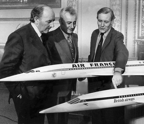 Tony Benn with Marcel Cavaille and Lord Beswick with models of Concorde during its