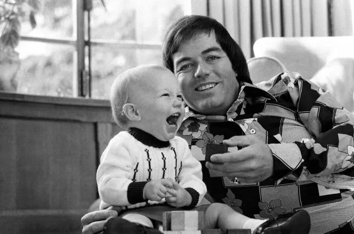 Framed Print : Tony Blackburn at home in Cookham Dean, Berkshire, with his son Simon. 5th September 1974 Framed Print : Tony Blackburn at home in Cookham Dean, Berkshire, with his son Simon. 5th September 1974