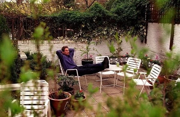 Tony Blair Labour Party leader at home resting in the garden sitting on chair