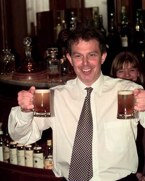 Tony Blair Labour Party leader in a pub holding two half pints of beer