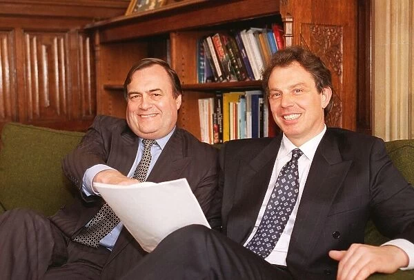 Tony Blair leader of the Labour Party with John Prescott sitting down together looking at