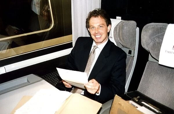 Tony Blair leader of the Labour Party onboard a train. July 1994