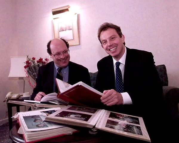 Tony Blair looking through family photograph albums