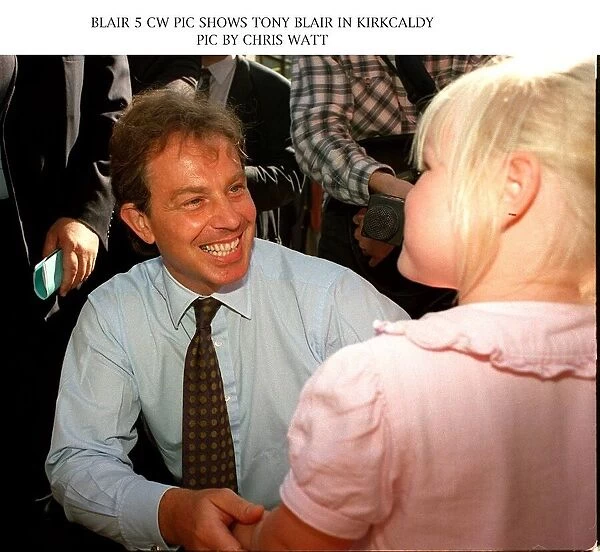 Tony Blair MP Labour Party leader talks to a child on a visit to Kirkcaldy Scotland