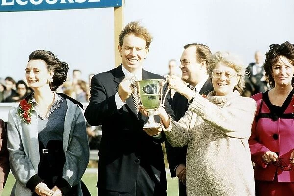 Tony Blair MP leader of the Labour Party holding a trophy