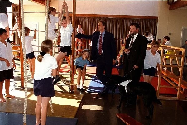 Tony Blair PM and David Blunkett Education Secretary watch a class in the gymnasium at St