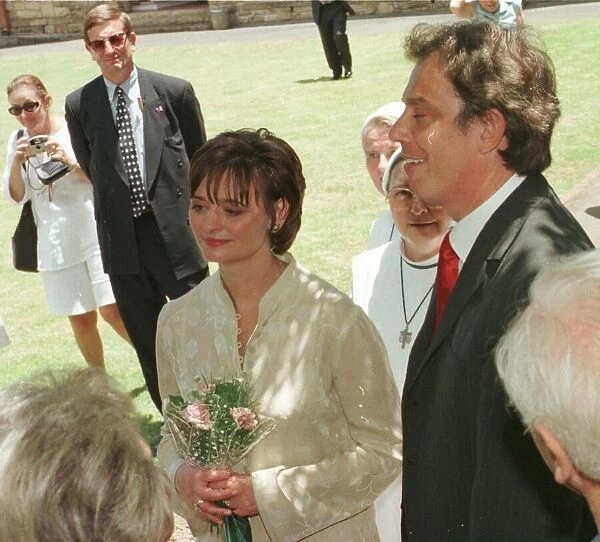 Tony Blair Prime Minister of Great Britain with his wife Cherie and detective Bill