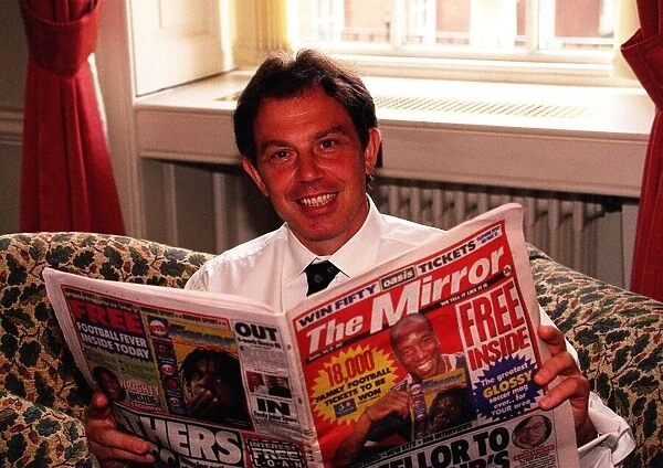 Tony Blair Prime Minister at Number 10 August 1997 reading a copy of The Mirror