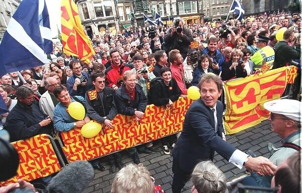 Tony Blair shaking hands with people in Parliament Square in Edinburgh September 1997